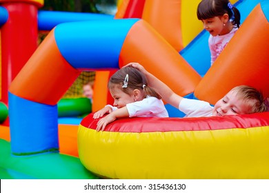 excited kids having fun on inflatable attraction playground - Shutterstock ID 315436130