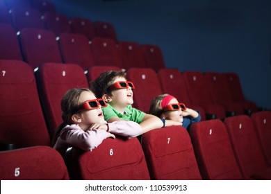 Excited Kids Watching Cartoon In The 3D Movie Theater