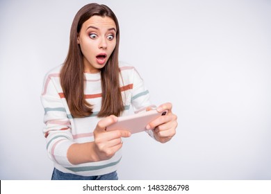 Excited lady terrified of losing telephone android game wear striped pullover isolated white background