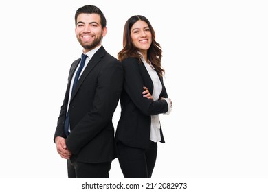 Excited latin attorneys working together as a team at the law firm. Happy business partners after making a great business deal - Powered by Shutterstock