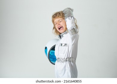 Excited Little Boy Wearing An Astronaut Helmet Costume And. Cute Kid In Astronaut Playing And Dreaming Of Becoming A Spacemen.