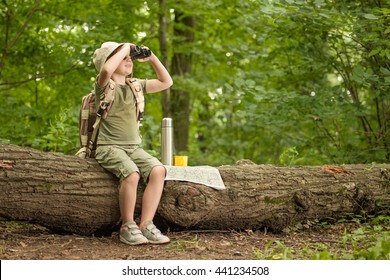 excited little girl on a camping trip in green forest - Powered by Shutterstock