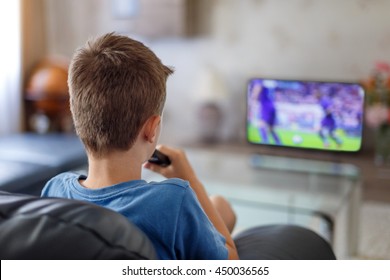 Excited Little Kid Watching Soccer Match In TV At Home