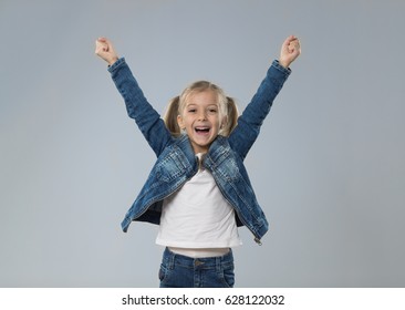 Excited Little Teenage Girl Hold Hands Up, Small Happy Smiling Child Isolated Over Gray Background