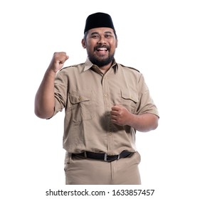 Excited Male Worker Wearing Brown Uniform Raised His Arm. Pegawai Negeri Sipil Indonesian Government Employees