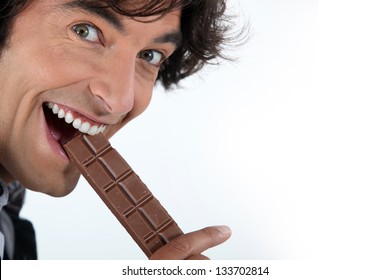 Excited Man Eating Chocolate Bar