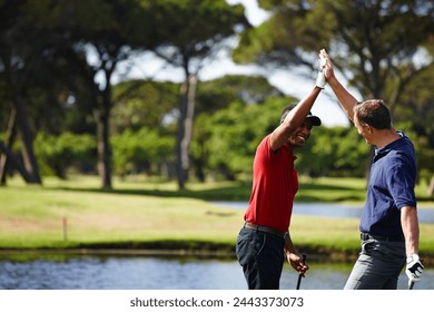 Excited man, high five and celebration with golf course for winning, point or score in outdoor nature. Male person, friends or people touching with smile for teamwork, victory or match on grass field - Powered by Shutterstock