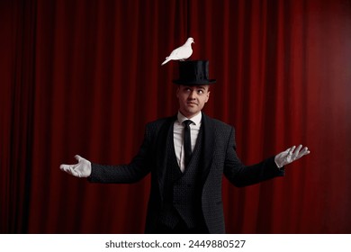 Excited man magician performing trick with beautiful white dove bird - Powered by Shutterstock