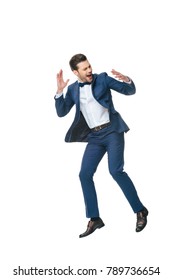 Excited Man In Suit Jumping Isolated On White