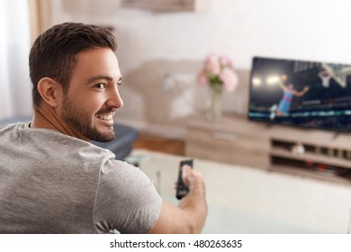 Excited Man Switch TV To Basketball By Remote Control