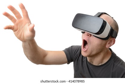 Excited Man Using A VR Headset And Experiencing Virtual Reality Isolated On White Background