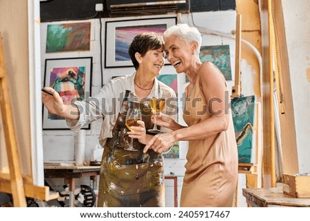 Similar – Image, Stock Photo Artwork of aged woman walking with dogs