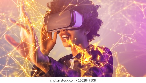 Excited modern black female using VR headset and interacting with virtual plexus interface in room with neon light - Powered by Shutterstock