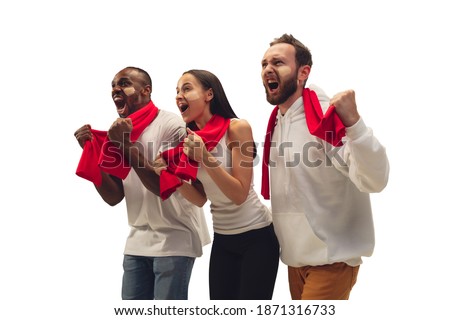 Excited. Multiethnic soccer fans cheering for favourite team with bright emotions isolated on white background. Beautiful caucasian women look excited, supporting. Concept of sport, fun, support.