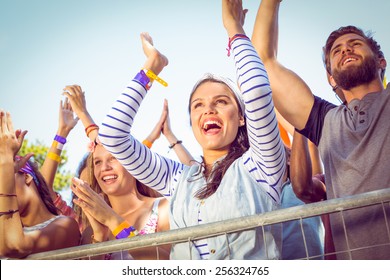 Excited Music Fans Up The Front At A Music Festival