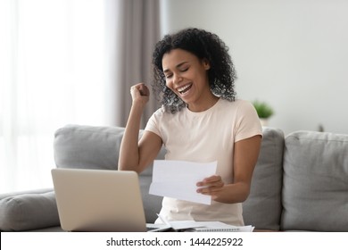 Excited Overjoyed Black Girl Student Holding Mail Paper Admission Letter Bank Statement, Happy Euphoric African Woman Read Good News Get New Job Scholarship, Celebrate Loan Approval Great Test Result