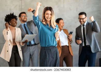 Excited overjoyed diverse business people, team celebrate corporate victory together in office - Powered by Shutterstock