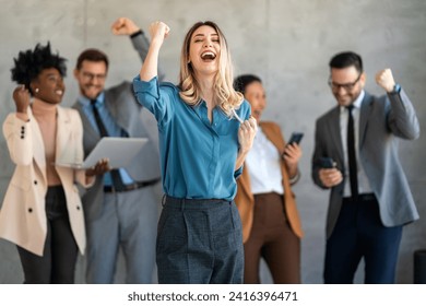 Excited overjoyed diverse business people, team celebrate corporate victory together in office - Powered by Shutterstock