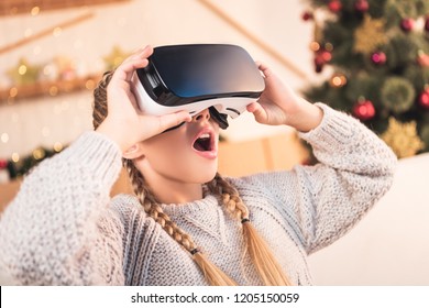 Excited Preteen Child Using Virtual Reality Headset At Christmastime