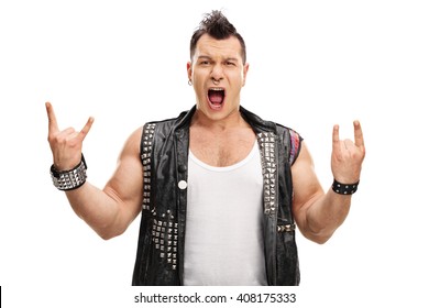 Excited punk rocker making rock hand gesture and looking at the camera isolated on white background