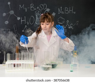 excited schoolgirl in fume after chemical experiment in school lab - Powered by Shutterstock