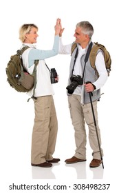 Excited Senior Hiking Mid Age Couple Giving High Five