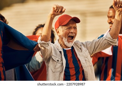 Excited Senior Soccer Fan Cheering For His Team During Sports Championship. 