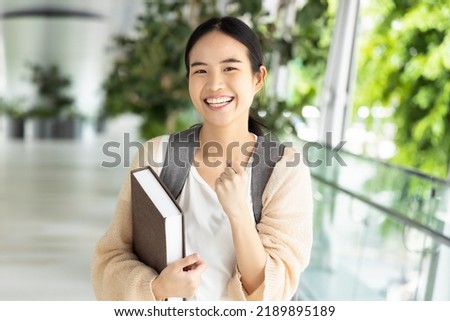 Excited and successful asian woman college student getting back to school, success education concept