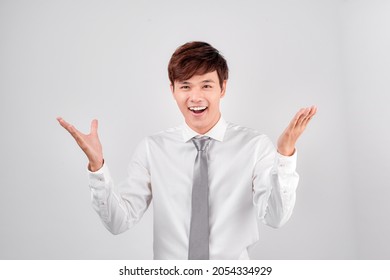 Excited Surprised Handsome Young Asian Man In Casual White Shirt Doing Open Hand Gesture