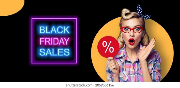 Excited surprised pinup beautiful woman in red glasses with % procent text. Pin up shocked girl with open mouth. Blond model - retro fashion and vintage ad concept. Black Friday sales neon light sign. - Powered by Shutterstock