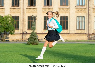 Excited teen girl running to school. Energetic schoolgirl carrying school bag midair. Back to school