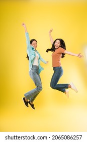 Excited Two Asian Woman Happy Smile Jump Up Celebrate Success With Raise Hands