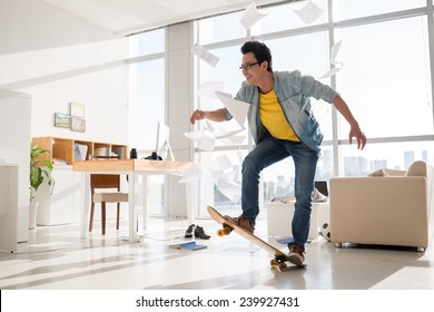 Excited Vietnamese skateboarder performing a trick in his room - Powered by Shutterstock