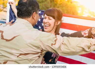 Excited Woman With American Flag Runs To Male Military Soldier Returning Home.