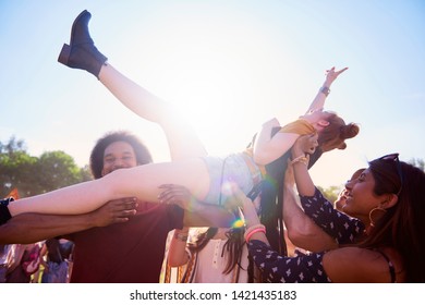 Excited Woman Crowd Surfing At Music Festival