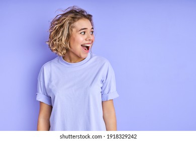 Excited Woman Laughing On Purple Background, Joyful Female In Casual Outfit Have Fun Looking At Side, Shine With Happiness. People, Lifestyle And Human Emotions Concept