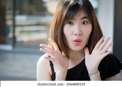 Excited Woman Looking At You With Surprise And Interest; Portrait Of Surprised Excited Asian Woman With Exciting, Oh, Uh, Ah, Wow Interesting Expression; Asian Young Adult Woman Model