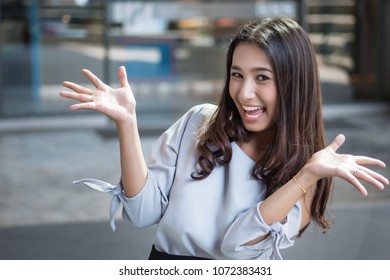 Excited Woman Looking At You With Surprise And Interest; Portrait Of Surprised, Excited Asian Woman With Exciting, Oh, Uh, Ah, Wow Interesting Face Expression; Asian Young Adult Woman Model