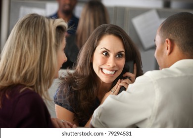 Excited Woman Office Worker With Colleagues On Phone