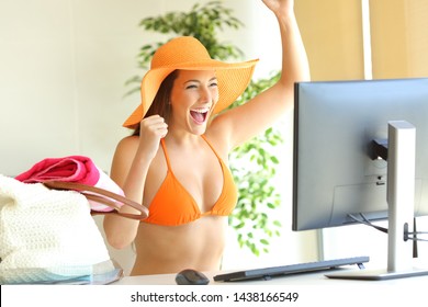 Excited woman ready to begin summer vacation checking computer content