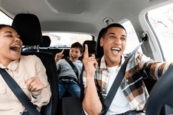 Excited Young African American Family Singing Riding New Car And Having Fun Enjoying Summer Road Trip On Vacation