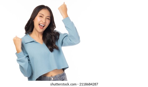 Excited Young Asian Female With Raised Hands Celebrating Success Portrait Cheerful Positive Asian Woman With Raised Hands And Fists Open Mouth Girl Get Happy, Enjoy Life Isolated On White Copy Space