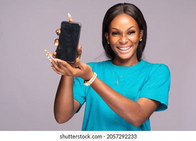 Excited Young Black Woman Showing Her Phone Screen, Advertising Concept