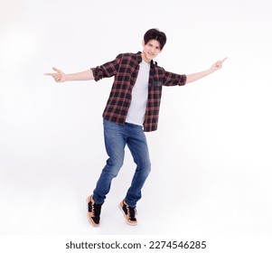 Excited young man dancing and jumping  isolated on white - Shutterstock ID 2274546285
