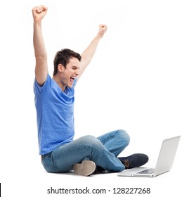 Excited Young Man Using Laptop