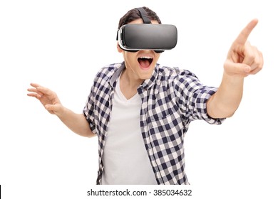 Excited Young Man Using A VR Headset And Experiencing Virtual Reality Isolated On White Background