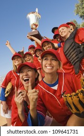 Excited Young Softball Team Cheering After A Winning Game