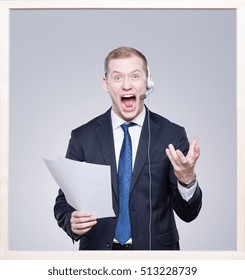 Excited Young Sports Commentator Screaming With Headset And Notes