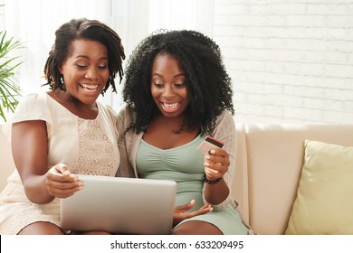 Excited young woman ordering food or clothes online
