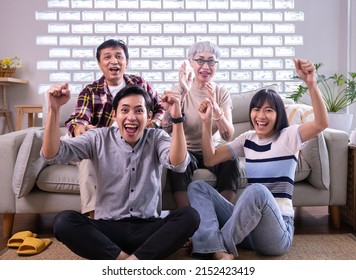 Excited,happy Big Family Watching Football, Soccer, Basketball,hockey, Tennis,rugby Match On The Couch At Home.Asian Fans Emotional Cheering For Favourite National Team.Sport, TV, Championship,Thai.